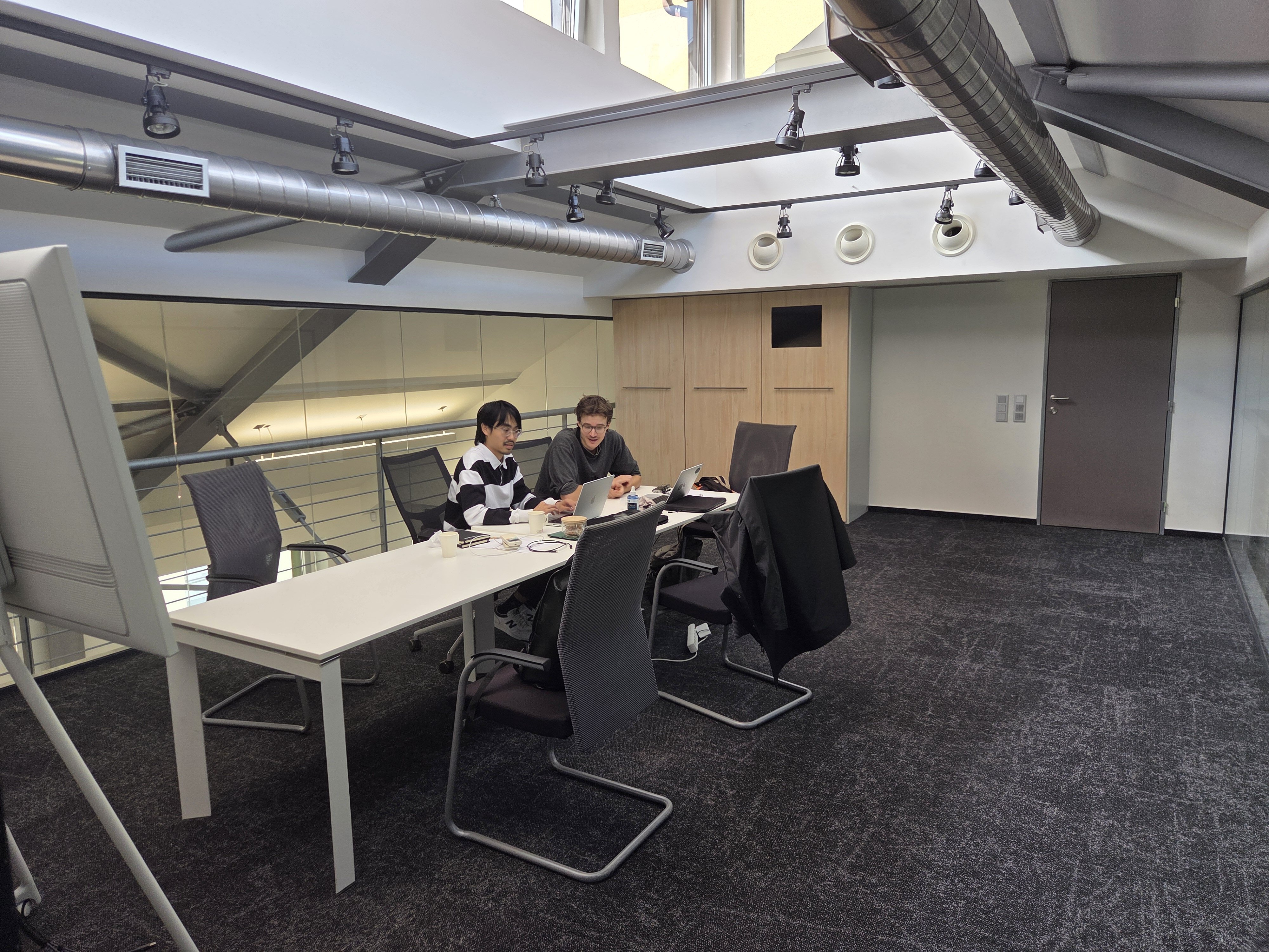 Prague AI Tinkerers working / discussion photo