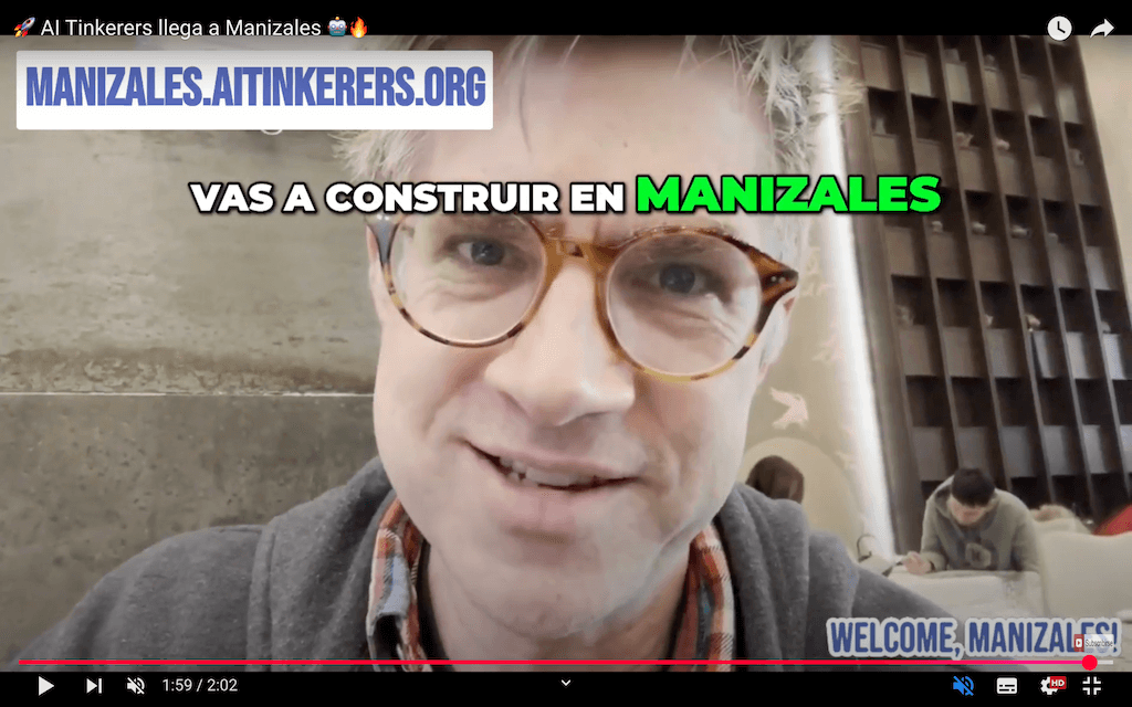 A man wearing glasses appears in a selfie-style video, with overlaid text promoting Manizales and a website.. Text: Al Tinkerers llega a Manizales
MANIZALES.AITINKERERS.ORG
VAS A CONSTRUIR EN MANIZALES
WELCOME, MANIZALES!
1:59/2:02