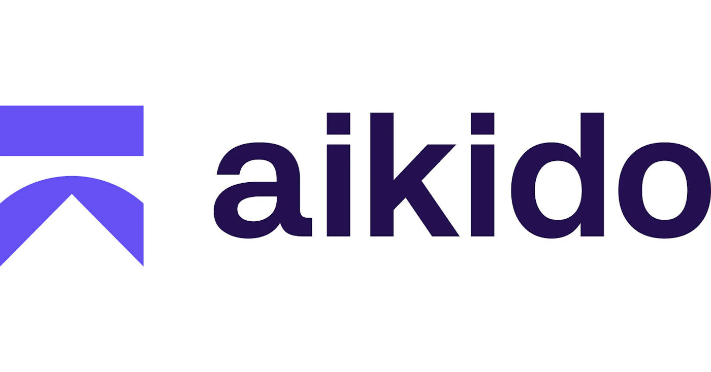 (Logo) A logo featuring a stylized geometric symbol in purple positioned to the left of the brand name "aikido," which is rendered in a dark indigo, lowercase sans-serif font on a white background. Text: aikido Colors: #2e1a5f, #5f42c6, #ffffff Note: The image is a professional design consisting of a graphic mark and a wordmark, clearly intended for brand identification, classifying it as a logo.