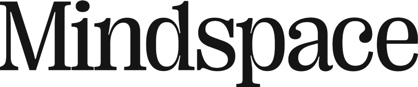 (Logo) A logotype featuring the word "Mindspace" is displayed in a heavy, dark serif typeface against a solid black background. Text: Mindspace Colors: #222222 Note: The image is a logotype, consisting only of the brand name 'Mindspace' rendered in a distinct, heavy serif typeface, typical of corporate identity branding.