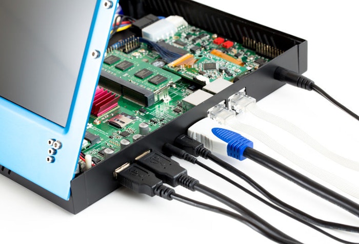 A photo of a small computer or embedded system with its case open, revealing the internal components and connected cables.