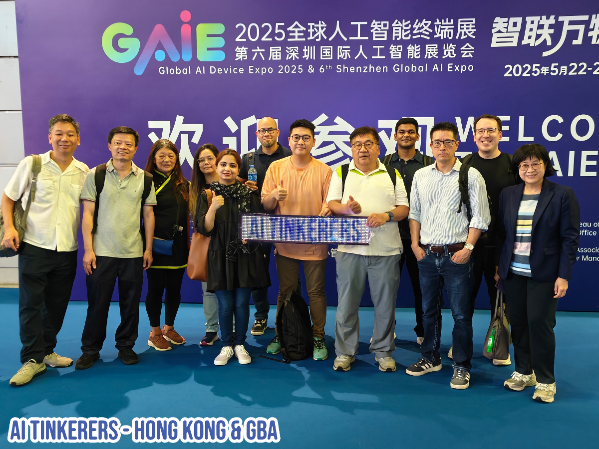 A group of people posing in front of a banner for the Global AI Device Expo 2025 & 6th Shenzhen Global AI Expo. One person is holding a sign that says 'AI TINKERERS'.. Text: GAIE 2025全球人工智能终端展 智联万物
第六届深圳国际人工智能展览会
Global Al Device Expo 2025 & 6th Shenzhen Global Al Expo
2025年5月22-2
欢源参VOELCO
AI TINKERERS
AIE
sau of
Office
Associa
Manc
AI TINKERERS- HONG KONG & GBA