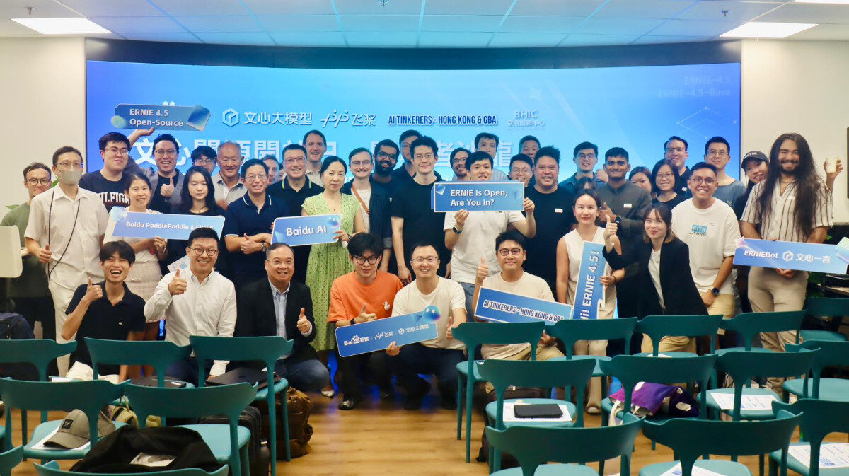 A diverse group of people are gathered indoors, smiling and posing for a group photo. Many individuals are holding blue signs with text, and a large screen behind them displays event information related to 'ERNIE' and 'AI Tinkerer's'.. Text: ERNIE 4.5
Open-Source
文心大模型
AI TINKERERS - HONG KONG & GBA
BHIC
ERNIE-4.5
ERNIE-4.5-Beta
文心
问百问百答
Baidu PaddlePaddle
Baidu AI
ERNIE Is Open, Are You In?
Hi! ERNIE 4.5!
AI TINKERERS - HONG KONG & GBA
ERNIEBot
文心一言
Baidu
PaddlePaddle
文心一言
