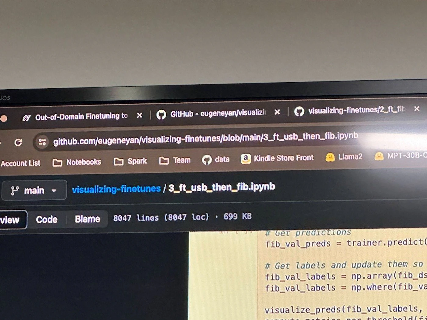 (Photo) A screenshot of a computer screen displaying code in a Jupyter Notebook environment. Text: JOS Out-of-Domain Finetuning to x GitHub - eugeneyan/visualizir x visualizing-finetunes/2_ft_fib x github.com/eugeneyan/visualizing-finetunes/blob/main/3_ft_usb_then_fib.ipynb Account List Notebooks Spark Team data Kindle Store Front Llama2 MPT-30B-C main visualizing-finetunes / 3_ft_usb_then_fib.ipynb view Code Blame 8047 lines (8047 loc)  699 KB #Get predictions fib_val_preds = trainer.predict() # Get labels and update them so fib_val_labels = np.array(fib_ds fib_val_labels = np.where(fib_va visualize_preds(fib_val_labels,                     threshold(fi computer screen | indoor | code, Jupyter Notebook | screenshot Note: The image is a photograph of a computer screen displaying a coding environment.  It captures a moment in time and is not a logo, banner, illustration, or handwriting.
