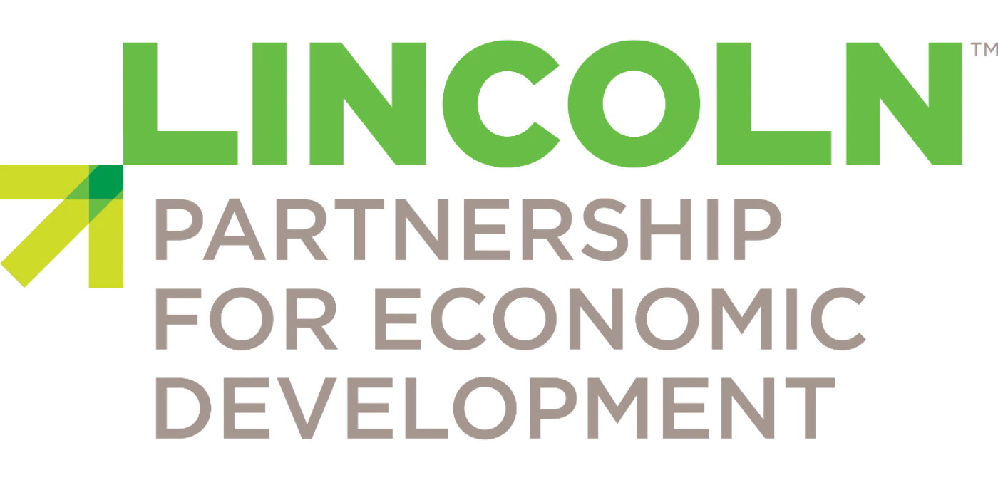 (Logo) The image displays a logo for 'Lincoln Partnership for Economic Development'. It features the word 'LINCOLN' in bright green, with 'PARTNERSHIP FOR ECONOMIC DEVELOPMENT' in a darker grey below it, accompanied by a stylized geometric arrow graphic. Text: LINCOLN™ PARTNERSHIP FOR ECONOMIC DEVELOPMENT Colors: #69C03C, #7F7F7F, #A5C82A, #000000 Note: This image is clearly designed as a brand identifier for an organization. It combines a distinct text arrangement with a unique graphic element, typical of a corporate or organizational logo.