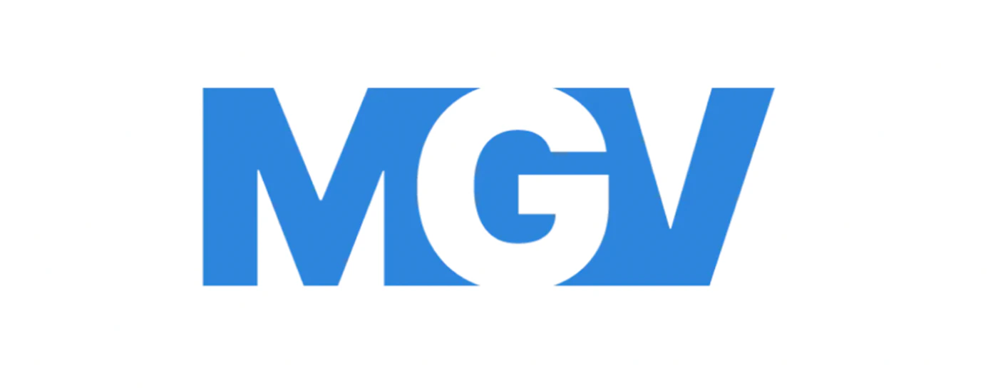 (Logo) The image displays a stylized logo featuring the letters 'MGV' in blue and white on a solid white background. The letter 'G' is cleverly formed using negative space between the 'M' and 'V'. Text: MGV Colors: #3377FF, #FFFFFF Note: The image consists of a highly stylized text element designed to represent a brand or entity, typical of a logo, rather than a photo, illustration, or general text.