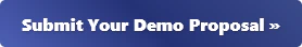 (Banner) The image shows a blue button with the text 'Submit Your Demo Proposal' and a double arrow symbol on it. Text: Submit Your Demo Proposal » modern | Colors: #345995 Note: The image is a rectangular shape with text on it, designed to attract attention and convey a message, which is characteristic of a banner.